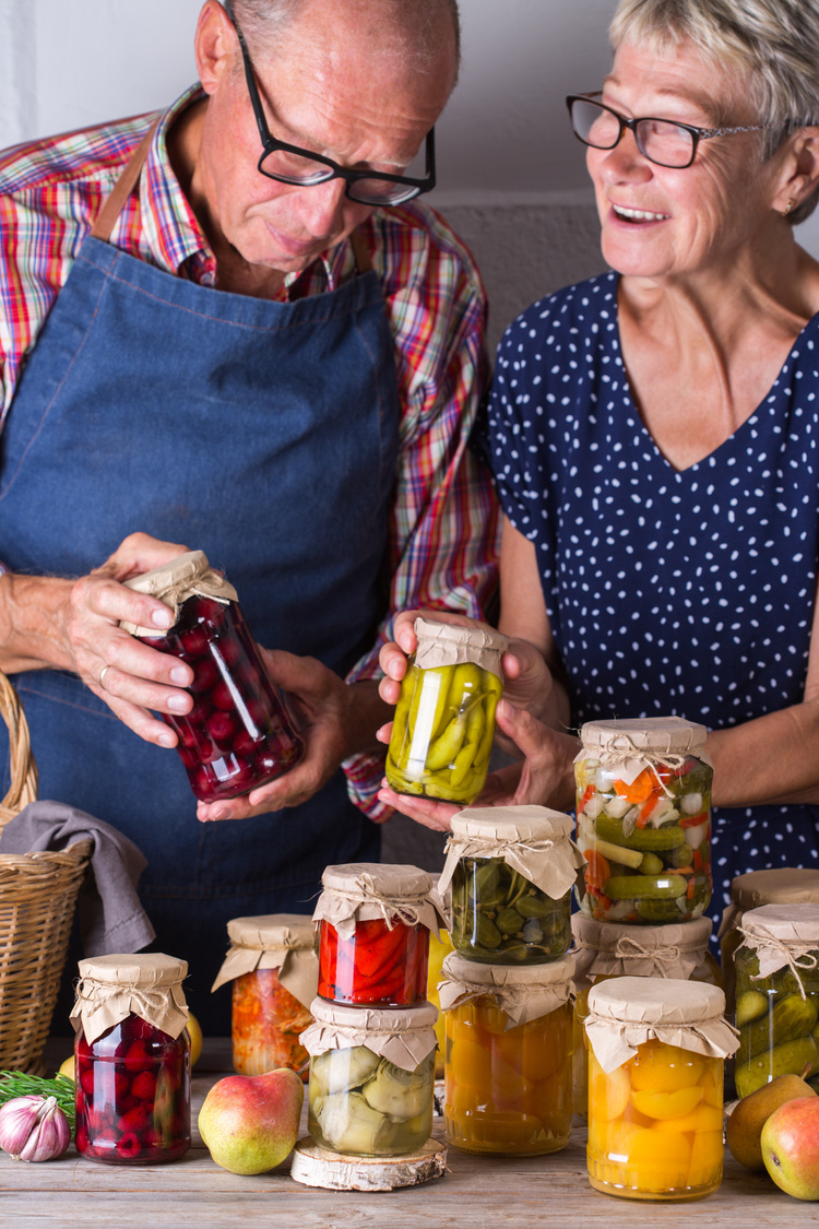 Elderly Couple with Homemade Preserved Food
