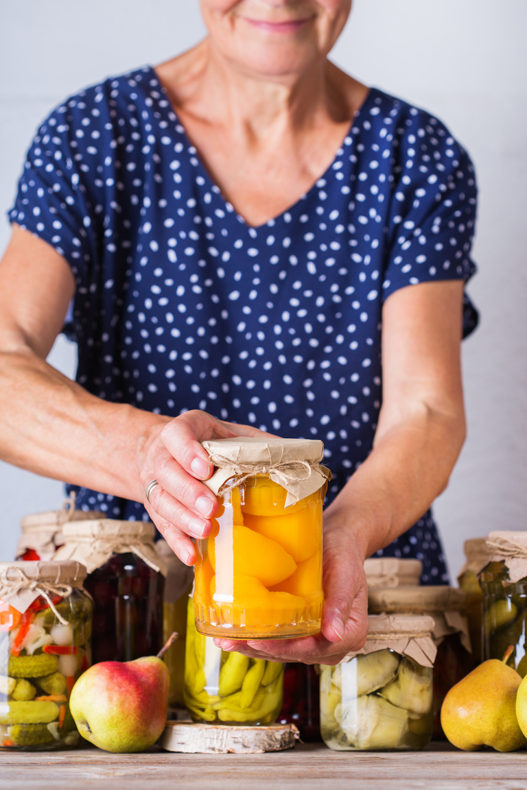 Senior Woman Holding Homemade Preserved Fermented Food