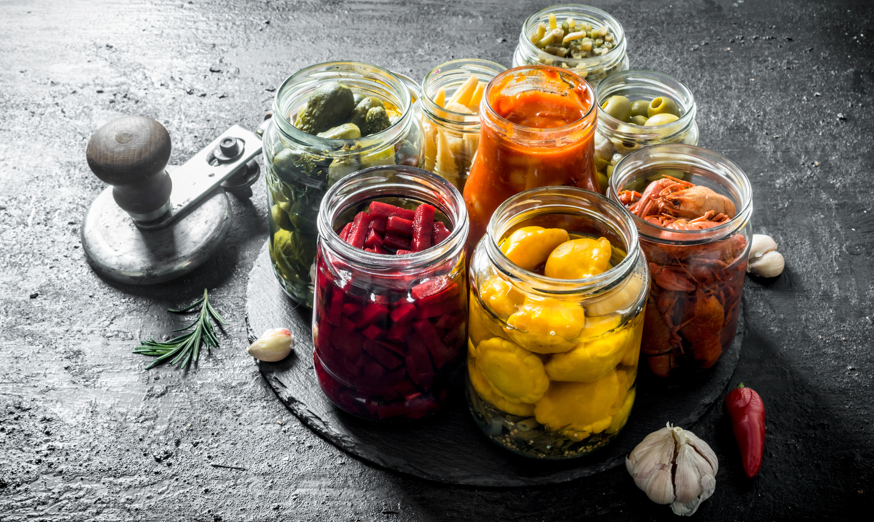 Pickled vegetables in glass jars.